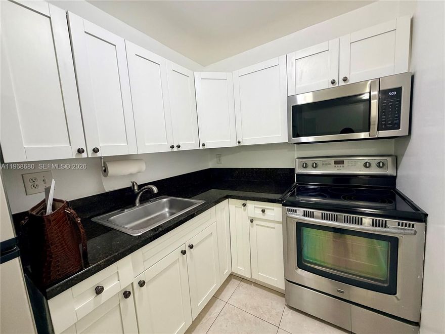 1st-floor apartment with balcony, all tile, large closet, freshly painted, great location, and excellent community at Palm Spring in Sabal Pointe Condominium. Water included—quick approval HOA on site, 1 bedroom / 1 bathroom.