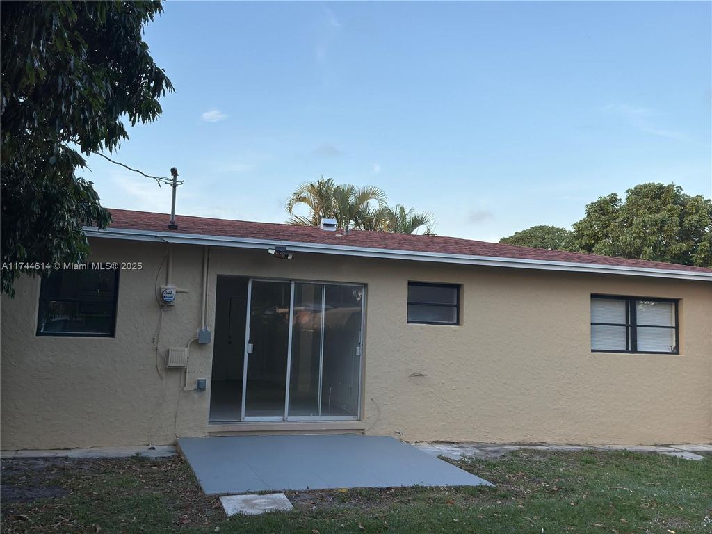 Photo of 738 Evergreen Dr, Lake Park, FL 33403 (MLS # A11744614)