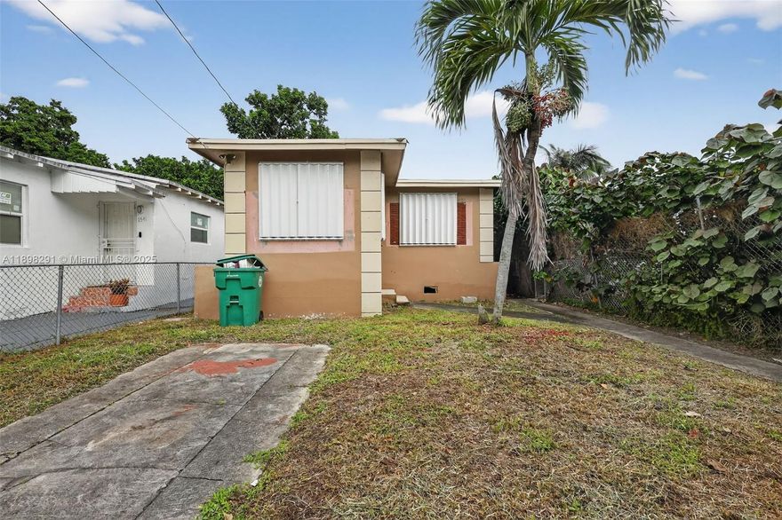 Huge Potential in Miami! Discover the possibilities at 1537 NW 70th Street, a spacious 2 bedroom, 1 bathroom home located in the heart of Miami. This home is perfect for buyers looking to customize and add value. With a fenced yard and fruit trees that add charm and shade there is plenty of room to create your dream home. Inside, the home offers a solid layout. While it needs TLC, the bones are strong and the potential is undeniable. With no HOA, you have the freedom to renovate and personalize without restrictions. Located near major highways, schools, and shopping, this home is both convenient and full of opportunity. Investors bring your tools and imagination - this is the one you’ve been waiting for! Kitchen has been removed. Cash only.
