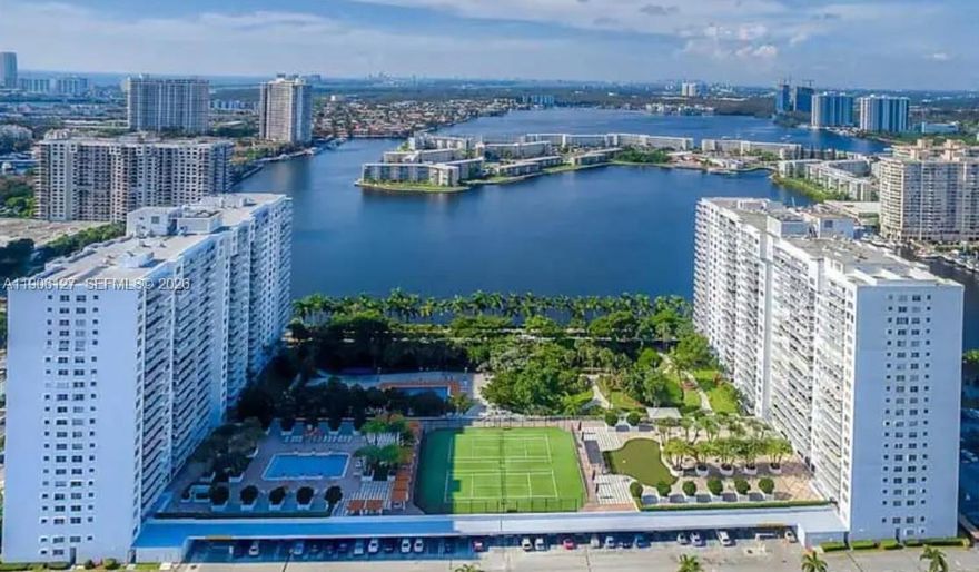 Welcome to Aventura, Florida! This rare direct waterfront corner unit offers 2 spacious bedrooms & 2 full baths with direct bay views , spectacular sunset and Intracoastal views. The open-concept layout is fully renovated to maximize water views from every angle, including the expansive wraparound terrace—perfect for dining or relaxing. The modern kitchen features an oversized island, floor-to-ceiling cabinetry, full pantry & extra storage. Enjoy resort-style amenities including two heated pools, tennis courts, gym and a well appointed outdoor summer kitchen alloeing for the perfect barbecue. Convenient same-floor laundry. Located minutes from Aventura Mall, world-class dining, and pristine beaches, this unit delivers luxury and location. Bus service to Aaventura Mall. Unit needs to be owned for 2 years before renting. Don’t miss this opportunity to own a renovated waterfront condo in Aventura’s prime location!  24 hour notice a must and only pre-qualified buyers!