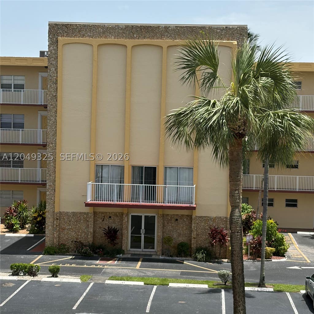 Photo of 3940 NW 42nd Ave #313, Lauderdale Lakes, FL 33319 (MLS # A12049325)