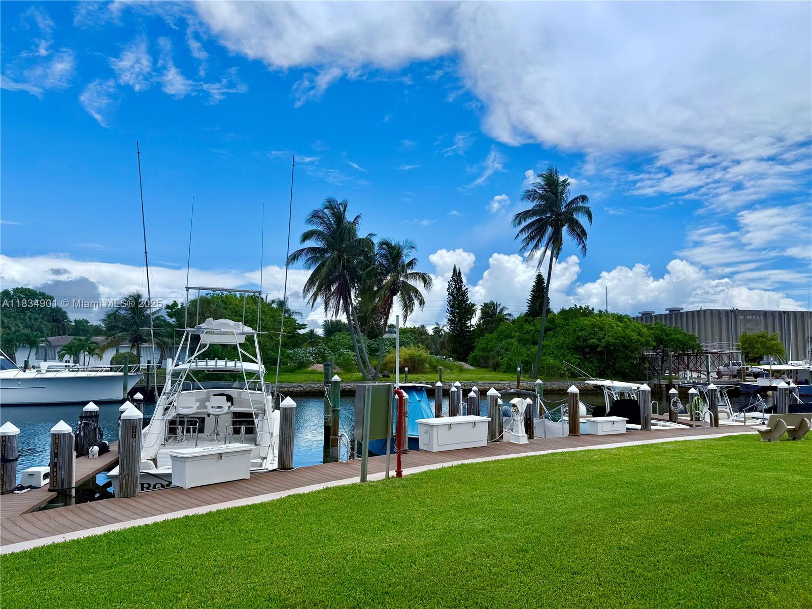 Convenient and private First floor unit with the most incredible views of the canal, marina and yachts drifting by. Enjoy a morning coffee in the glass enclosed lanai or open the sliders if you prefer the fresh air, perfection for year-round enjoyment of the Florida weather. This super clean 1 1.5 has had a small bedroom configured so you in essence have a 2/2 for when you have company. The half bath has also had a shower added so you will have 2 full baths. Enjoy the gym, heated pool, sauna, BarBQ grills and shuffleboard, all with a beautiful marina/canal view. The community has undergone a massive renovation project which is towards the end of completion according to our board. The HOA fees inc funding full reserves. The 493 mo balance of assessment to be assumed by the buyer.