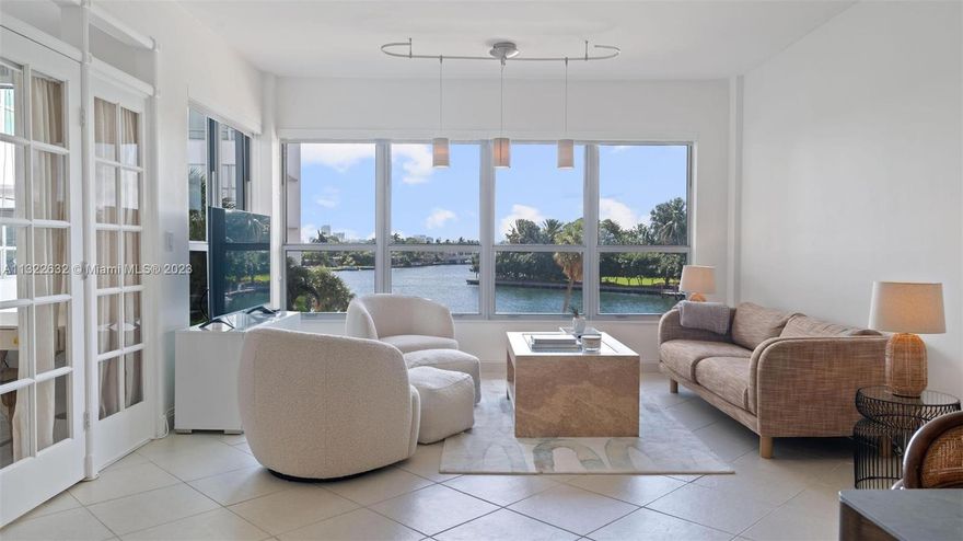 You'll feel at home the minute you step into this waterfront apartment in the Blair House, a chic MIMO building in the heart of Bay Harbor. Brand new wall-to wall hurricane impact windows provide captivating views of the pool, bay and Indian Creek Island from every room. With over 1100 SF of living area, this 1 bedroom/1.5 bath + den lives large and offers a ton of versatility. The den is currently set up as a second bedroom, with French doors that open to the oversized living/dining room. The primary bedroom has a large walk-in closet and ensuite. Additional upgrades include new stainless appliances, fresh paint and new carpet in bedroom. Enjoy this slice of Old Florida just blocks from Bal Harbour Shops, restaurants and the best beaches and parks in the area. Also available for rent.