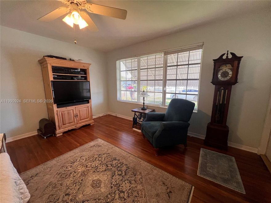 Fantastic opportunity in west Hialeah! This charming 3-bedroom, 1.5-bath single-family home sits on an oversized 6,300 SF lot with plenty of space to expand or create your dream outdoor retreat. The home features a welcoming covered, porch convert to parking car or enjoying the comfortable patio area, living & dining areas, wood flooring through the house, and a functional kitchen with ample cabinet space. Enjoy a large carport for added convenience. Located in a quiet, family-friendly neighborhood just minutes from Amelia Earhart Park, shopping centers, restaurants, and top-rated schools. Easy access to major highways including I-75 and the Palmetto Expressway makes commuting a breeze. Perfect for first-time buyers or investors seeking 9 great home with endless potential in a prime location!