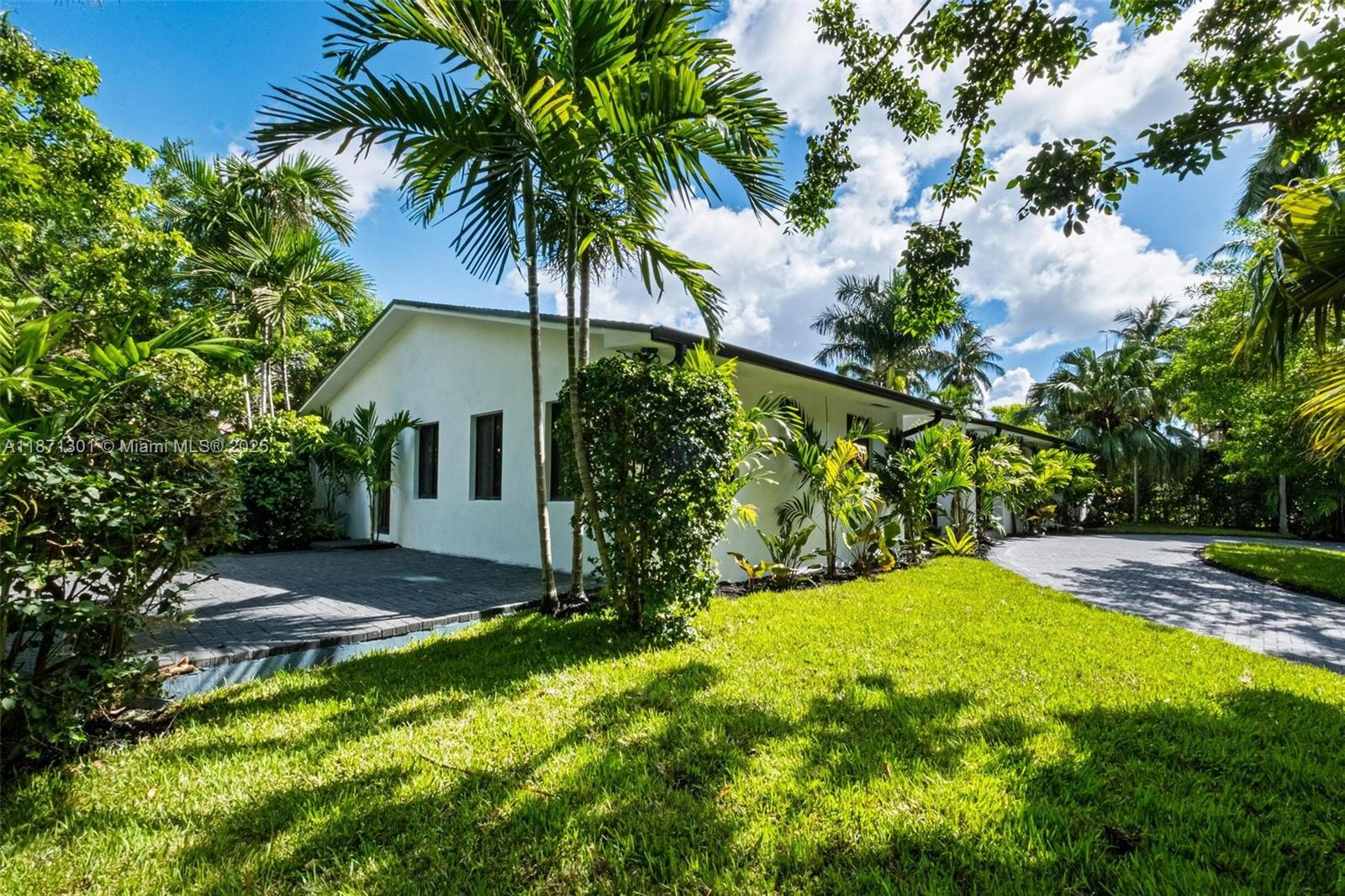 Beautifully remodeled 3-bed, 4-bath home on exclusive gated North Bay Island. Spacious open-concept living with modern kitchen, oversized island, premium appliances, and abundant natural light. Enjoy multiple terraces with direct access to the living room, perfect for indoor-outdoor living. The primary suite features a walk-in closet and en-suite bath, plus two additional bedrooms with adjacent bathrooms. This charming modern home is surrounded by lush greenery and palm trees, offering a private tropical retreat in the heart of Miami. Offered unfurnished, available now, minimum 1-year.
