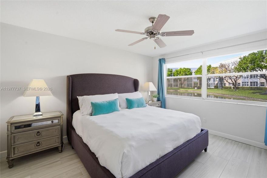 Beautifully remodeled, move-in-ready, two-bedroom, two-bathroom ground-floor condo located in the highly desired Sunrise Lakes Phase IV 55+ gated community (Inc. 3).  This move-in-ready unit features neutral colors, non-slip ceramic plank flooring throughout, a bright modern eat-in kitchen with spacious custom cabinets, granite countertops, and stainless-steel appliances, fully renovated bathrooms, custom blinds, a stackable washer/dryer inside the unit, and a screened-in patio with custom storm shutters.  Enjoy top-tier amenities, including a 9-hole golf course, heated pool, gym, tennis, pickleball, billiards & 5 satellite pools. Main clubhouse offers a 1,000 seat theater with bingo, dances, and shows. Cable, internet, water, pest control, trash & insurance are included. Near freeways, minutes to Sawgrass Mall and 20-25 minutes to Fort Lauderdale Airport & Beaches. Bring your best offer… Motivated Seller!