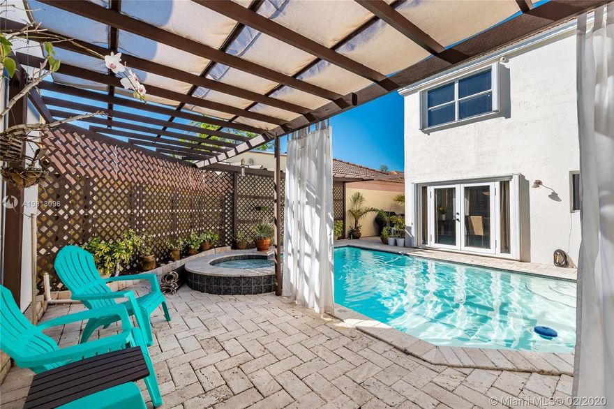 On a quiet & friendly cul-de-sac you will fall in love with this 2 story; 4 bed; 3 bath elegant & move in ready home, featuring high ceilings; natural light; laminate & wood floors. On the 1st floor, family/guests can enjoy 1 bedroom with en suite bath; renovated kitchen; dining, living & family rooms; 2 car garage; fenced backyard: covered sitting area; pool & Jacuzzi; 2nd floor offers large master suite with walk-in closet; 2 bedrooms sharing another bath. ?All meticulously maintained, including fresh paint; hurricane protection; 5 ton AC & SS appliances. Associations boast low fees, security patrol & high % of owners, who keep the area safe & in top shape. Nearby club house has parking; tennis; gym & party space. Community abuts parks; highways; airport; employers; shops; & A+ schools.