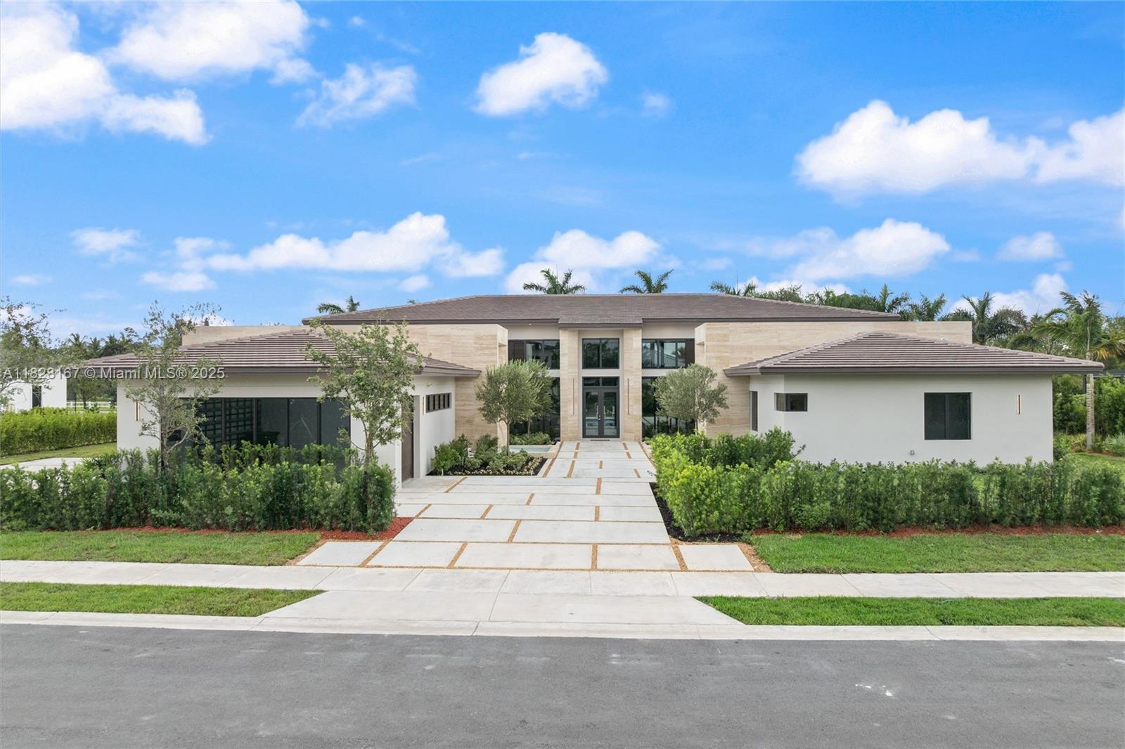 A masterpiece of Mediterranean charm and modern luxury, this 5BD/5.5BA custom estate features a den, media room, mud room, and a 3-car garage with a sleek glass wall. Bold travertine walls and cascading water features create a spa-like entry that sets the tone for the elegant design throughout. Enjoy two outdoor pergolas—one with a summer kitchen for entertaining, the other off the primary suite for private lounging. The resort-style pool, fully landscaped grounds, and high-end finishes complete this one-of-a-kind home. Located in a private 12-residence enclave, this is one of the final homes. Every detail has been meticulously curated for elevated living.