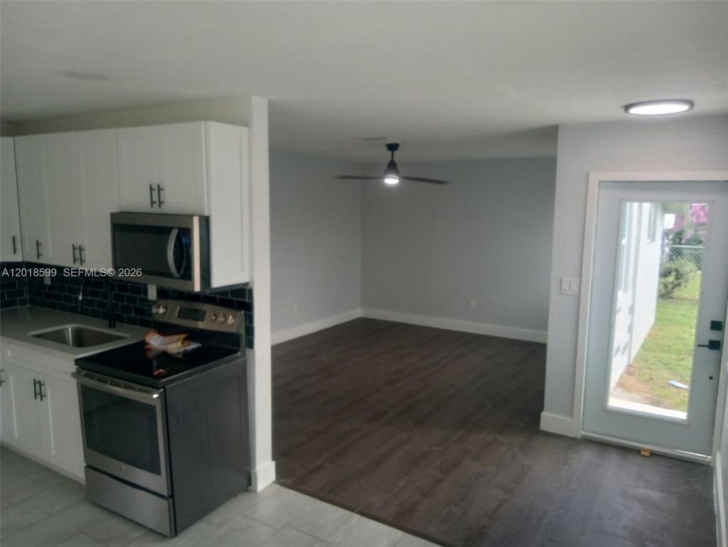 Photo of 1070 NW 23rd Rd, Fort Lauderdale, FL 33311 (MLS # A12018599)