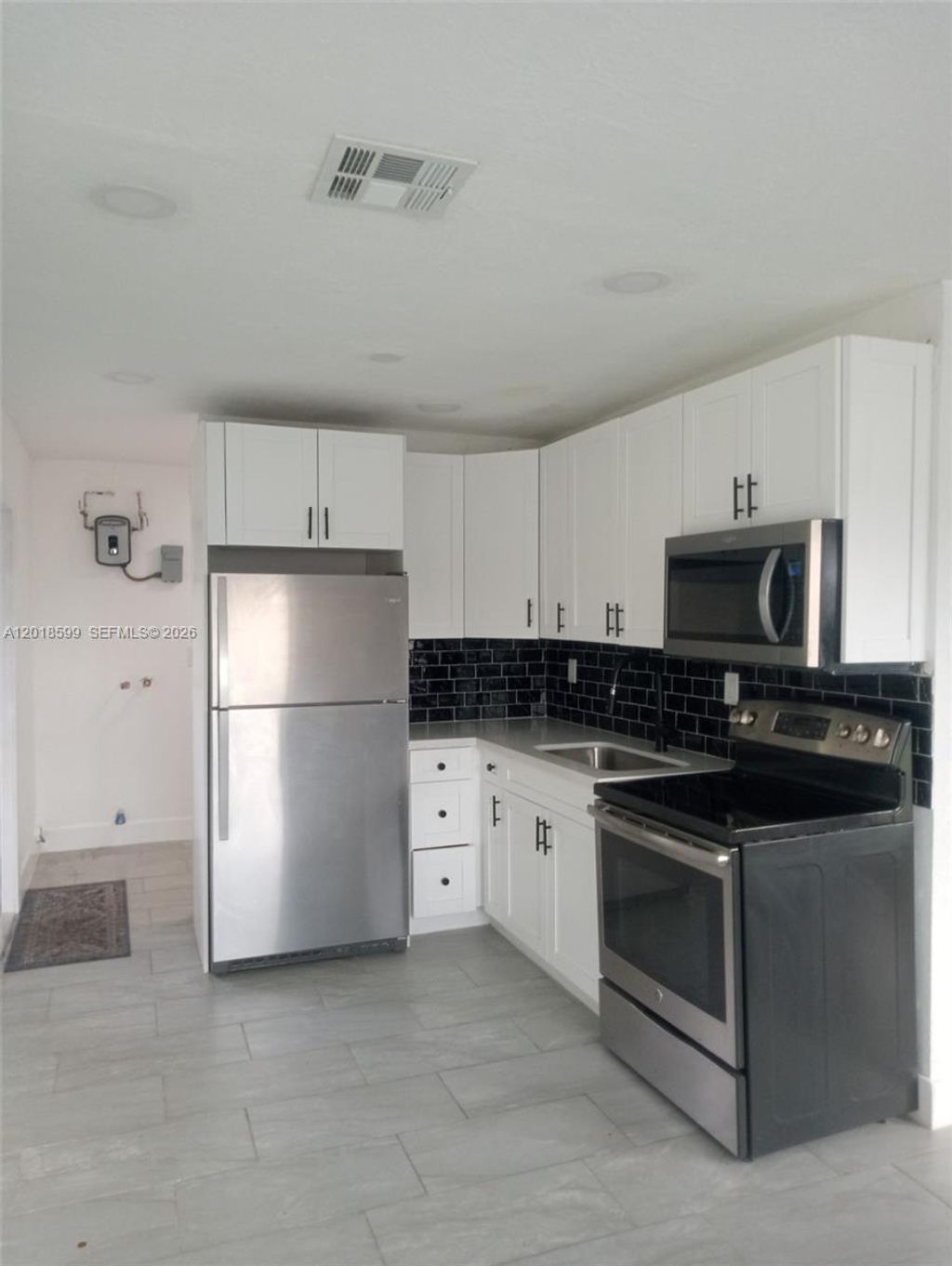 Photo of 1070 NW 23rd Rd, Fort Lauderdale, FL 33311 (MLS # A12018599)