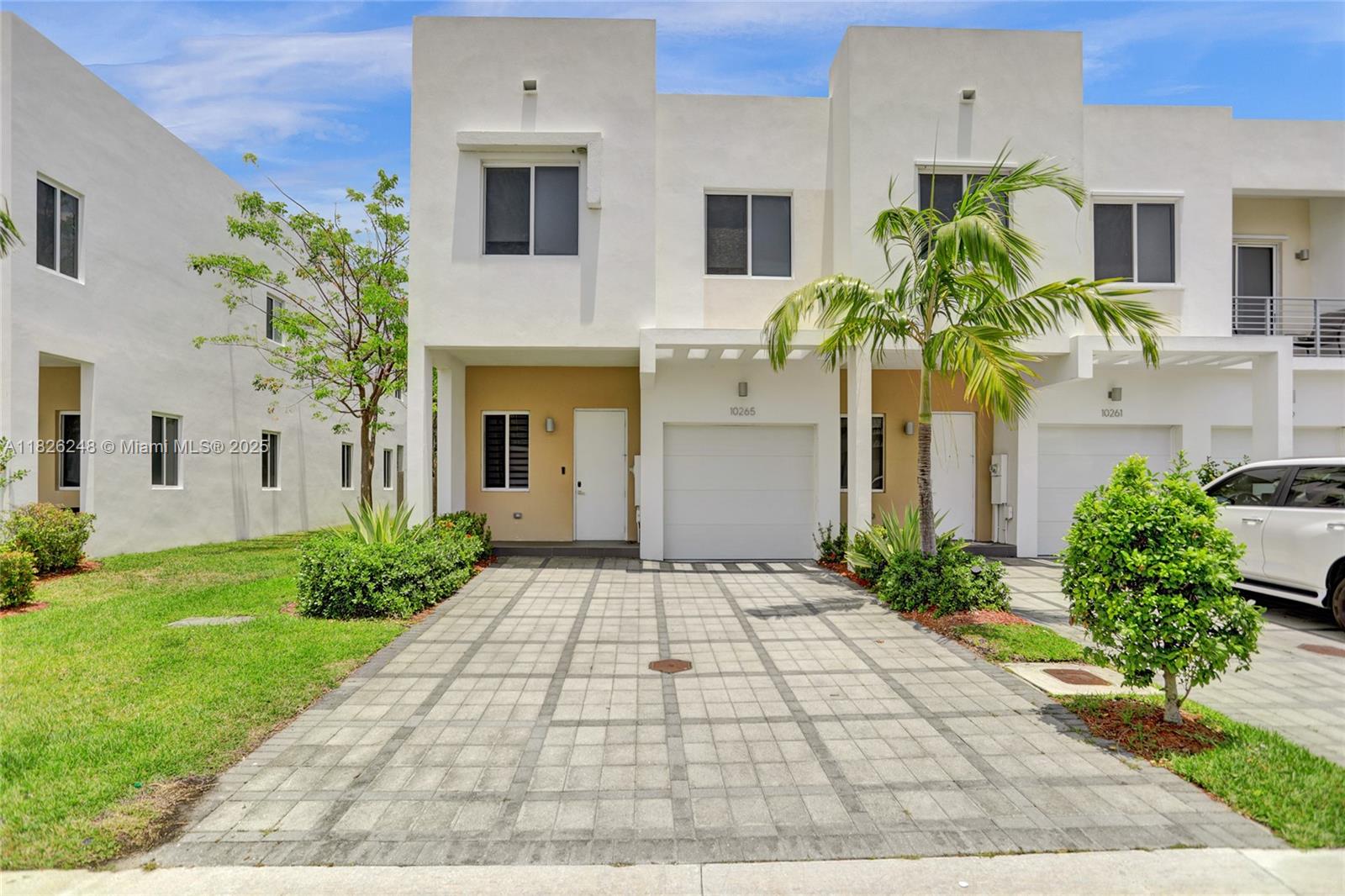 Modern and spacious 4BR/4BA corner townhouse for rent in the highly sought-after Neovita at Doral. Built in 2017, this large model offers 2,043 SF of living area, with a 1-car garage plus driveway for 2 additional cars or more. Featuring porcelain tile flooring on the first floor, high-impact laminate wood flooring upstairs, and an open-concept kitchen with sleek finishes, SS appliances. Access to enjoyment in the privacy of your enclosed patio with built-in BBQ. Recessed lights, recently painted, zebra blinds. Exquisite taste!! Gated community with resort-style amenities, close to top-rated schools, shopping, dining, and major highways. Available now.