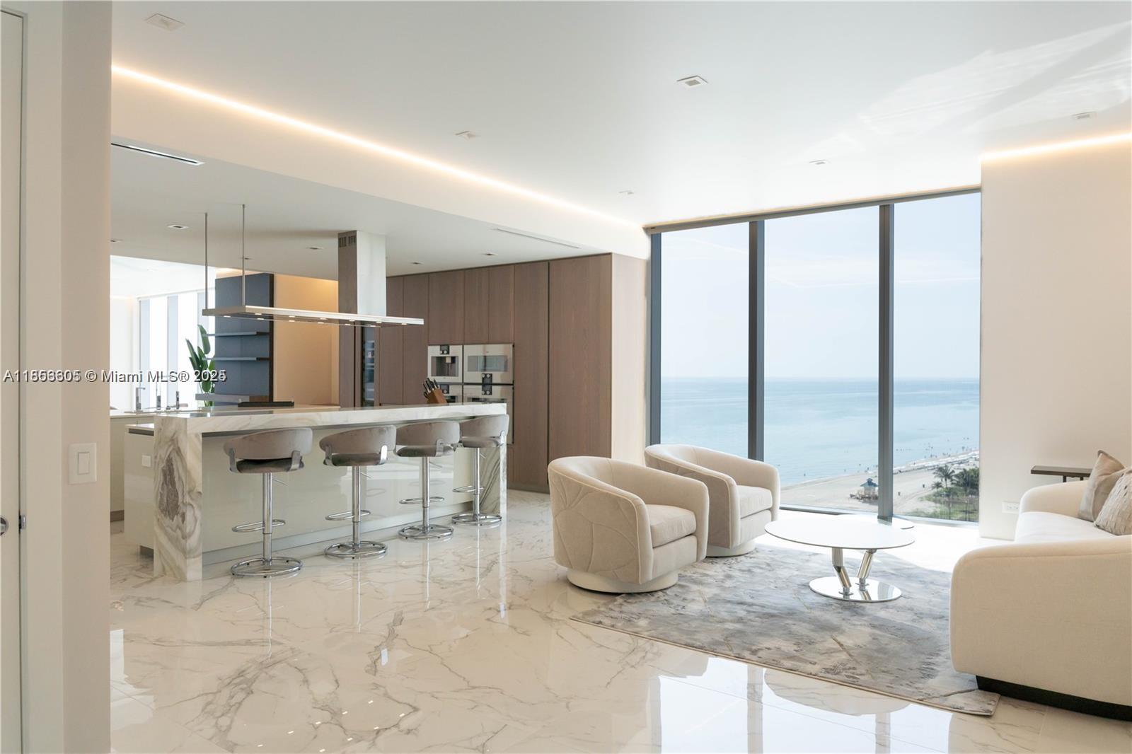 Live the ultimate beachfront lifestyle in this furnished 4-bedroom + den, 5.5-bath flow-through corner residence at the prestigious Turnberry Ocean Club. Enjoy breathtaking direct ocean and Intracoastal views from floor-to-ceiling glass and expansive terraces. This home features designer finishes, top-of-the-line appliances, and an elegant, open layout perfect for entertaining. Turnberry Ocean Club offers six full floors of amenities, including private beach service, three swimming pools, state-of-the-art fitness center, spa, private dining, and entertainment areas. Experience world-class luxury living in the heart of Sunny Isles Beach.