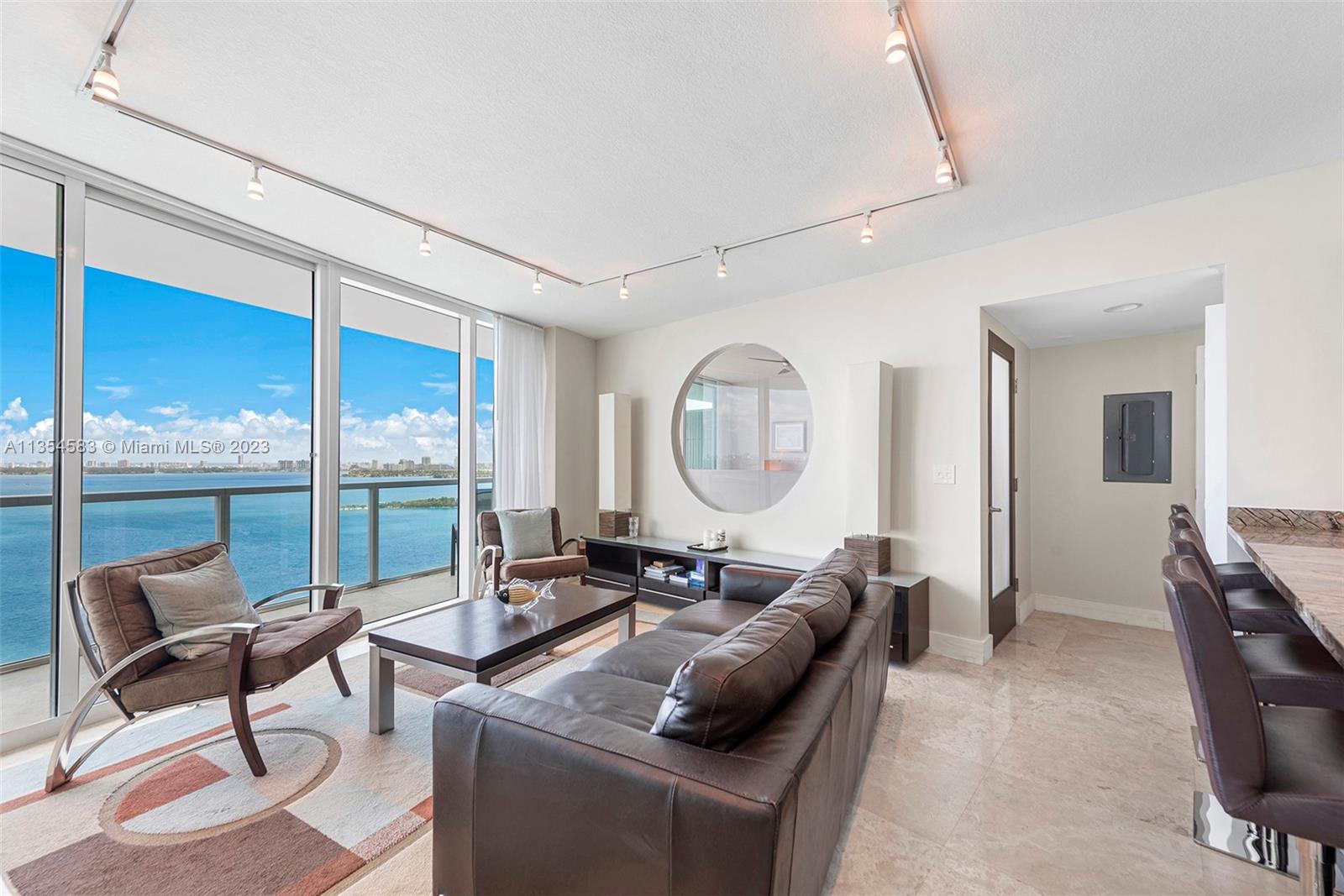 Fully furnished unit with breathtaking bay and city views from every room. Split floorpan with two spacious bedrooms both with private bathroom, plus a half bath in living room. Open kitchen with granite countertops and ample cabinet space. Boutique building offers resort style amenities includes: fitness center, infinity-edge pool w/ jacuzzi on the bay, steam room, sauna, billiard room and a 24-hour concierge service. Two assigned covered parking spaces included and visitor parking. NO PETS- option to renew