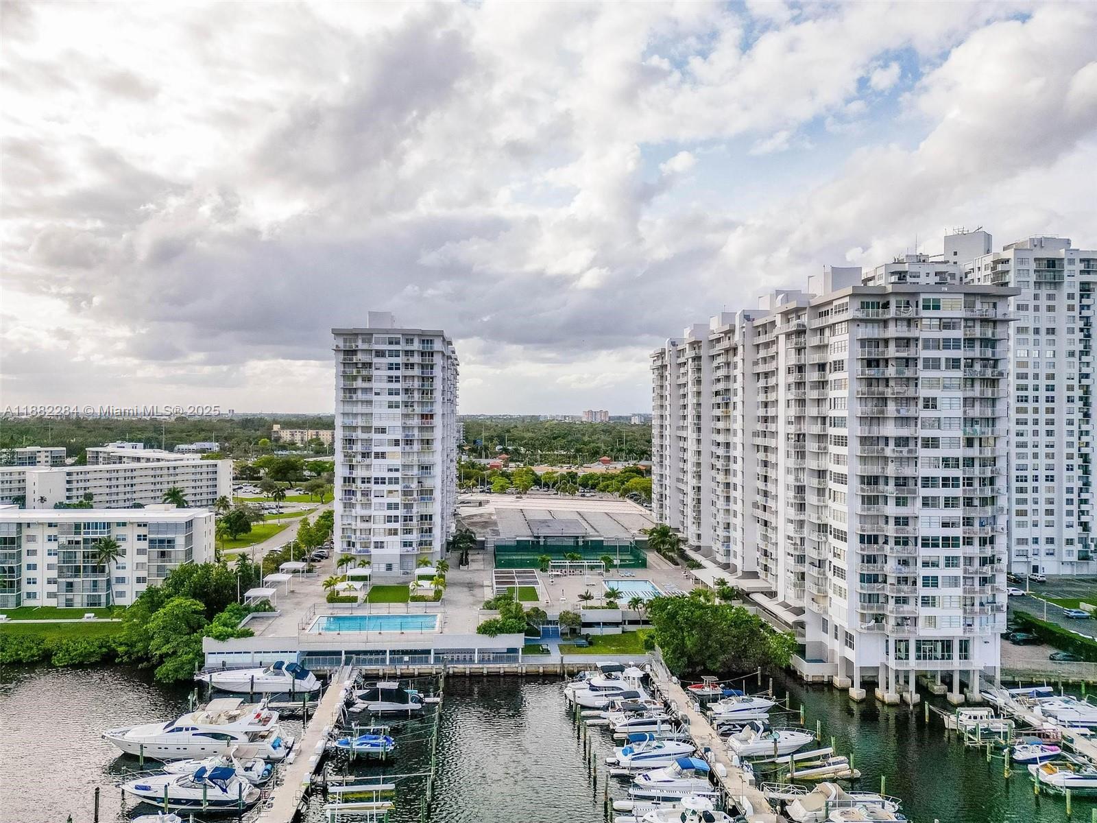 Amazing water & city view from this 2/2 unit with a den.1556 SQ FT. Open Kitchen lots of closets. Very bright unit. Many amenities including 2 swimming pools, Tennis court, exercise room. Sauna, BBQ area , fishing pier. convenience store & restaurant in the premises as well a Beauty Salon. Walking distance to Supermarkets, banks, dry cleaners, restaurants. Cover parking