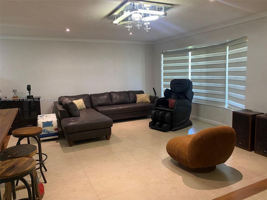 Single story house in quiet neighborhood of Hollywood Hills. 3BR 2 BTH. NEW central AC. Attractive open kitchen with beautiful custom cabinets, custom teak eating counter with matching wood seats for 6-8 people. Ceiling fans in all BR and bathrooms. Separate Dining Room. Sunken Florida Room that opens on to the pool via electric roll away doors. Spacious screened-in pool. Pool deck ideal for entertainment. One car garage with storage shelves. Laundry and extra fridge in garage. Driveway accessible via back alley can accommodate 6 cars. Two matured mango trees. Furniture negotiable. Massage chair not included in the sale.  Use Show Assist to request all showings. Contract is subject to approval of probate court of Broward County, Florida