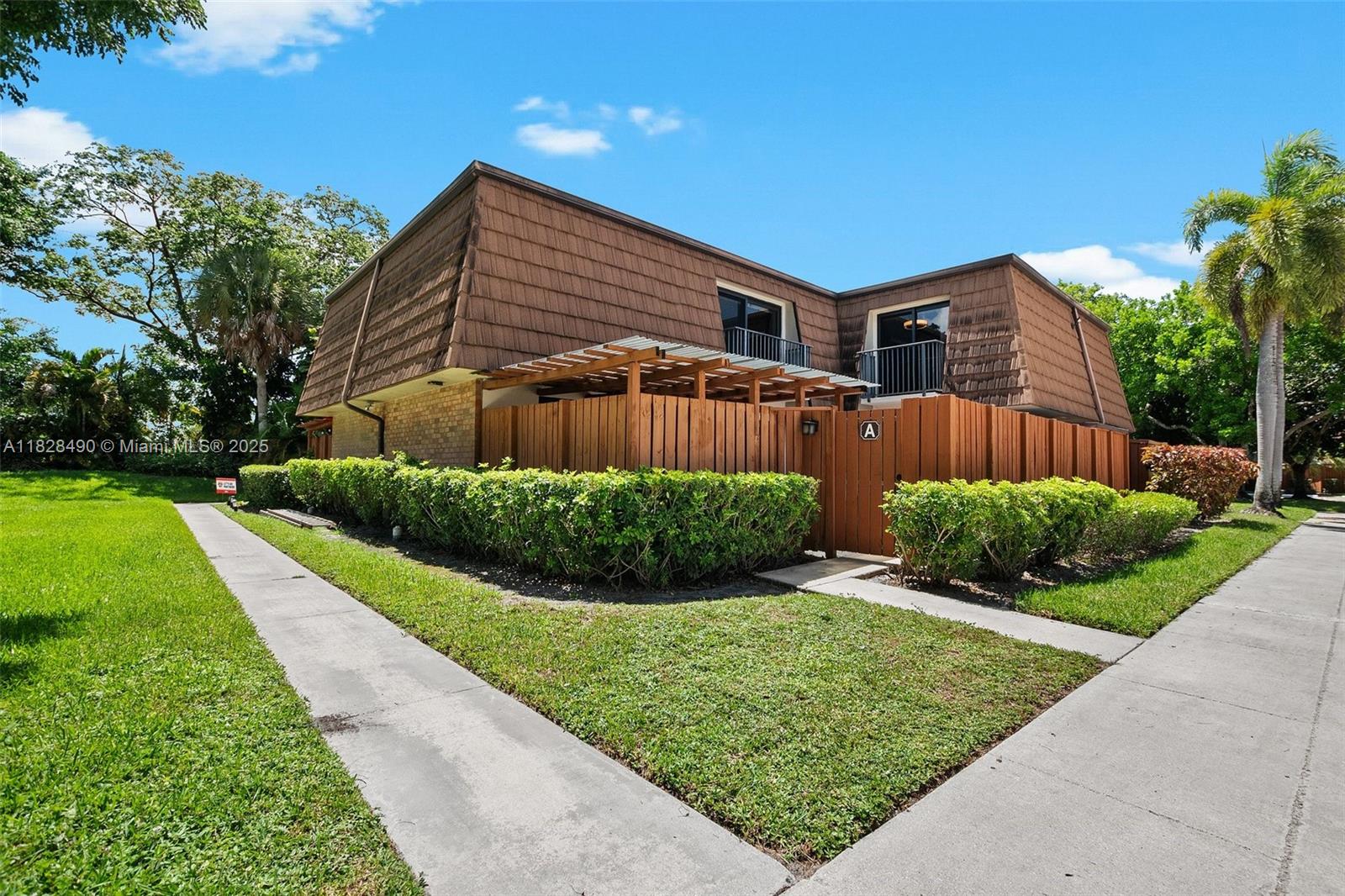 This appealing move-in ready townhome located in desirable Ridgewood at Pine Island Ridge features a spacious renovated kitchen and bathrooms. It is equipped with high impact windows and the roof is currently being replaced. The sizeable enclosed patio allows for private year round entertaining and relaxation. Located close to major highways allows for easy access to the beaches, airport and other places in the tri-county area. Great schools make this a great home to raise a family. The HOA includes membership to the Country Club at Pine Island Ridge, which offers two restaurants, a gym, a spa, a swimming pool, access to the golf course, tennis courts, barbeque area and other amenities. Be part of this great community and enjoy the country club lifestyle!