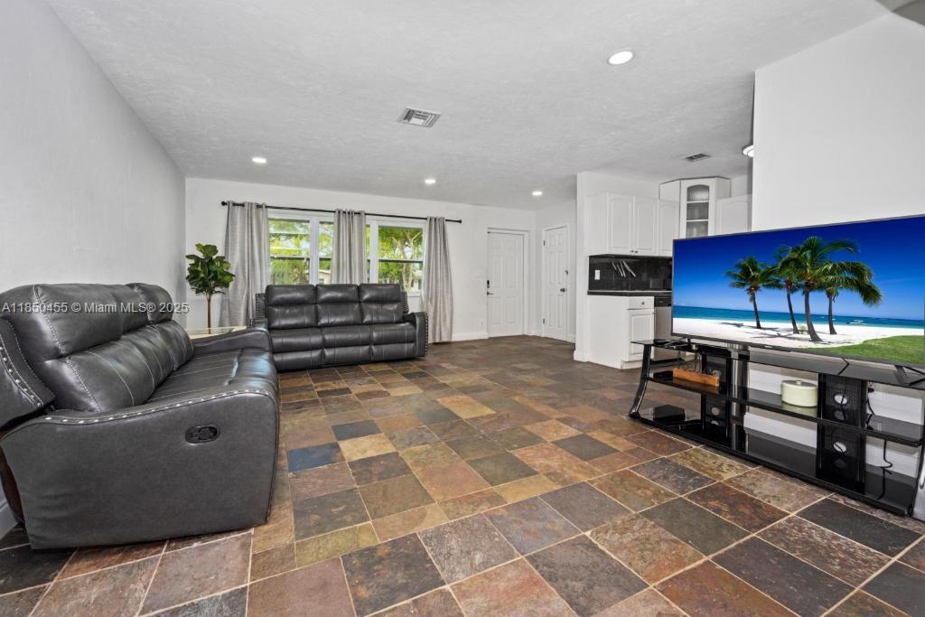 Beautifully renovated private paradise. Spacious 3 bedroom, 2 bath home on over 10,000 square feet of private lot for rent. Furnished or unfurnished. Home is ready to move in, but can be shown sooner. Large open kitchen/living room and light-filled Florida room that overlooks a peaceful fenced-in backyard. Your private oasis awaits! New roof, A/C 2017, large laundry room. Close to Wilton Manors. Don't miss this one to enjoy for years to come.