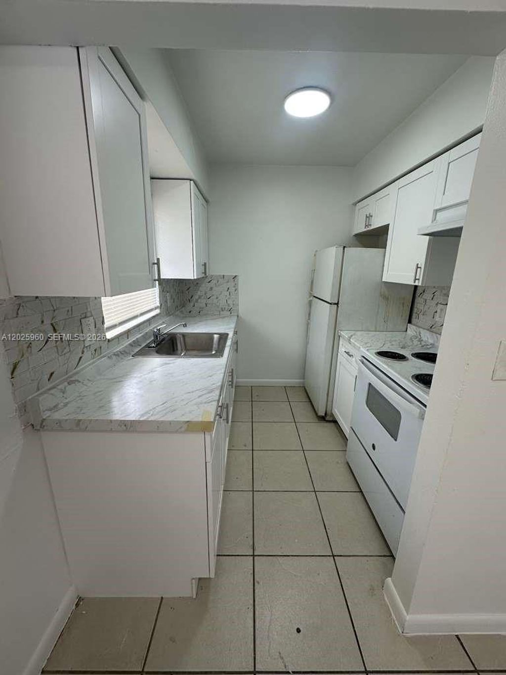 Photo of 3961 NW 30th Ter #1, Lauderdale Lakes, FL 33309 (MLS # A12025960)