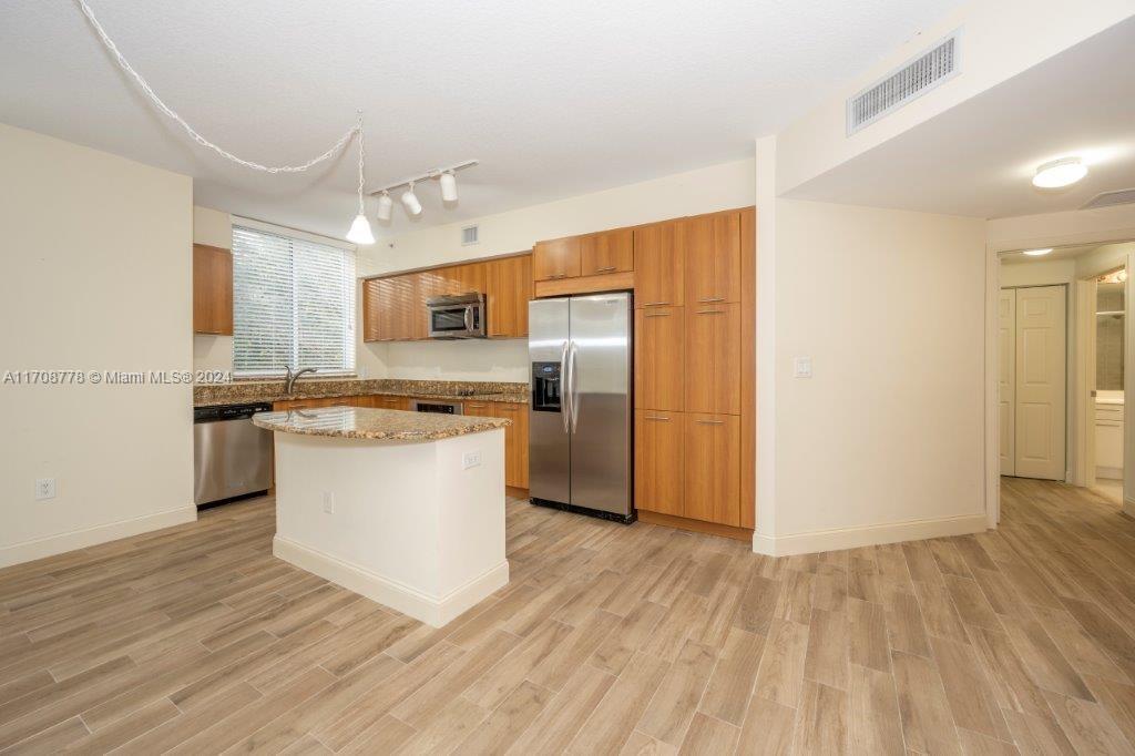 Nothing compares to this updated apartment at the exclusive Veranda in Plantation. Just a five-minute walk takes you to a tree-lined path around a serene lake or a charming village center with coffee shops, grocery stores, banks, and your favorite pizza. This stunning unit features granite countertops, stainless steel kitchen appliances, European cabinetry, a marble shower with a soaking tub, and an in-unit washer/dryer. Enjoy resort-style amenities, including a tropical pool, jacuzzi, fitness center, sauna, 24-hour manned security, smart key FOB building entry, and a high-tech security system.