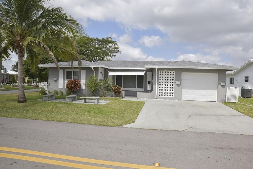 Photo of 4701 NW 43rd Ave, Tamarac, FL 33319 (MLS # A11792390)