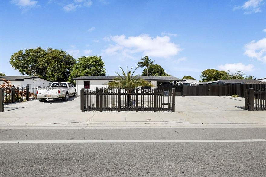 Discover this spacious, fully remodeled home featuring three comfortable bedrooms and two bathrooms. Enjoy the benefit of two terraces perfect for relaxation and entertaining, along with an exceptionally large side yard offering ample space for boat, RV, truck, or creating a fantastic outdoor recreational area. The impact windows and doors enhance the home's modern and bright aesthetic throughout the interior.