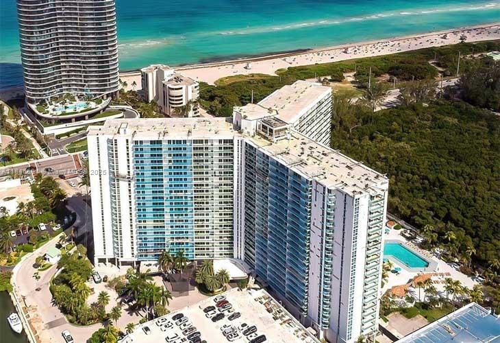 penthouse located in the iconic Arlen House in Sunny Isles Beach. Panoramic ocean, intracoastal, city views The spacious primary suite includes an en-suite bathroom, shower, walk-in closet. The second bedroom is ideal for guests, a home office, or both. Resort-style building offers 24/7 concierge, valet, security, a heated pool, tennis courts, gym, sauna, on-site restaurant, and more. Just steps from the beach and minutes to Bal Harbour Shops and Aventura Mall. Maintenance includes A/C, internet, cable, water, and all amenities.