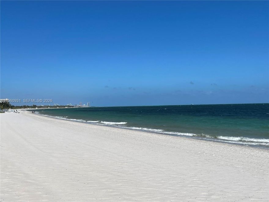 Beautifully positioned in Emerald Bay at Key Colony, this spacious 2-bedroom, 2-bath residence offers an inviting layout and scenic views that capture the essence of Key Biscayne living. The private balcony overlooks lush palm trees with the Miami skyline beyond, along with views of the bay, colorful sunsets, and a glimpse of the ocean.

Bright living and dining areas provide comfortable space for everyday living and entertaining. The residence features a remodeled kitchen with updated finishes, renovated bathrooms, marble and wood flooring, and custom lighting fixtures throughout.

The generous primary suite offers space for a seating area and includes an additional closet and vanity. The primary bathroom features a custom wood wall unit, walk-in closet, and dual sinks with a marble countertop. The guest bedroom also includes a custom-made walk-in closet.

Key Colony amenities include direct beach access with chairs and umbrellas, three pools including an oceanfront pool with casual bar and restaurant, tennis courts, playgrounds, a gourmet market, and 24-hour security. Located just across the Rickenbacker Causeway from Miami. Seller paid the $40K+ special assessment.