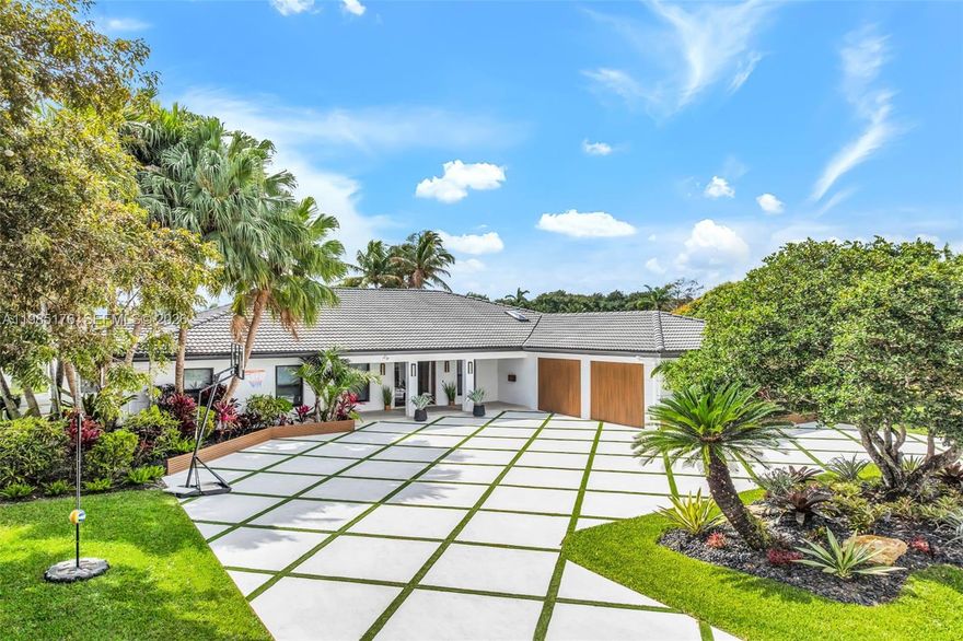 A rare offering in Emerald Hills, this reimagined waterfront estate combines true ocean access, sweeping lake, canal, and golf course views, & a level of finish well beyond the neighborhood standard.

Designed for both daily living & entertaining, the home features open living spaces, walls of glass, & a resort-style backyard overlooking the water and greens. The chef’s kitchen is equipped with natural gas, a professional-grade cooktop, & a custom high-heat pizza oven.

A fully integrated smart home system provides seamless control of lighting, climate, security, & audio. A comprehensive security system offers peace of mind, while hidden in-wall and in-ceiling speakers deliver whole-home sound without visible equipment.

Additional highlights include a spa-like primary suite, custom closets, full-home generator, natural gas infrastructure, impact windows and doors, & a functional layout balancing openness with defined spaces.

The backyard offers a private retreat with a 12 person spa, pool, multiple lounge & dining areas, & a fully equipped outdoor kitchen designed for elevated entertaining — perfect for hosting & searing steaks while enjoying views of the water & golf course. Direct water access allows for paddle boarding & jet skiing from your own backyard.

Ideally located near houses of worship, major roadways, shopping, dining, Beaches & FLL, this is a truly unique opportunity in Emerald Hills.