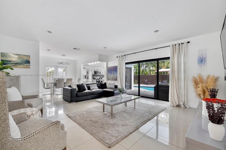 Discover your private tropical oasis in the sought-after Imperial Point neighborhood of Fort Lauderdale! This fully renovated and tastefully furnished 4-bedroom, 2-bath residence boasts an open-concept design filled with natural light, sleek tile flooring, Corian countertops, and stainless steel appliances. Outside, indulge in resort-style living with a heated pool, pergola, cabana bath, outdoor shower, and expansive covered patio, which is perfect for entertaining or relaxing. Additional highlights include keyless entry, premium furnishings (3 queens + 1 king), and a fully stocked kitchen. Ideally located just minutes to the beach, Las Olas, Wilton Manors, Flagler Village, fine dining, shopping, and the airport.