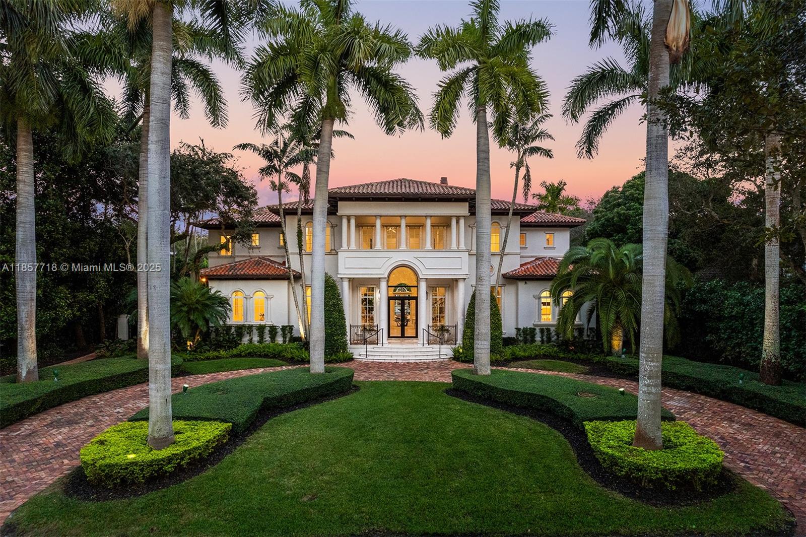 Luxury estate on esteemed Suburban Dr in Pinecrest, boasting a through-lot design. Ideal for a large family, w dual staircases that divide the foyer & formal living rm w soaring ceilings. Main level includes entertaining space, formal dining rm & open-style kitchen. Family rm is enhanced w a bar, fish tank, & workspace. Primary suite on main level enjoys its own wing, w a sitting/nursery rm. Staircases lead to distinct wings, one side 3 beds & 3 baths, and the other w 2 beds & 2 baths, featuring hardwood floors & renovated baths. Backyard is a paradise, w pool, jacuzzi, basketball court, & putting green. Additional luxuries: outdoor courtyard, water features, summer kitchen, detached guesthouse w 2 beds, living, & kitchen area, 3 car garage, & spacious motor court.