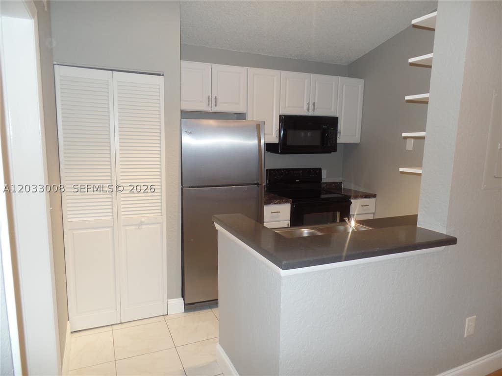 Photo of 2871 N Oakland Forest Dr #308, Oakland Park, FL 33309 (MLS # A12033008)
