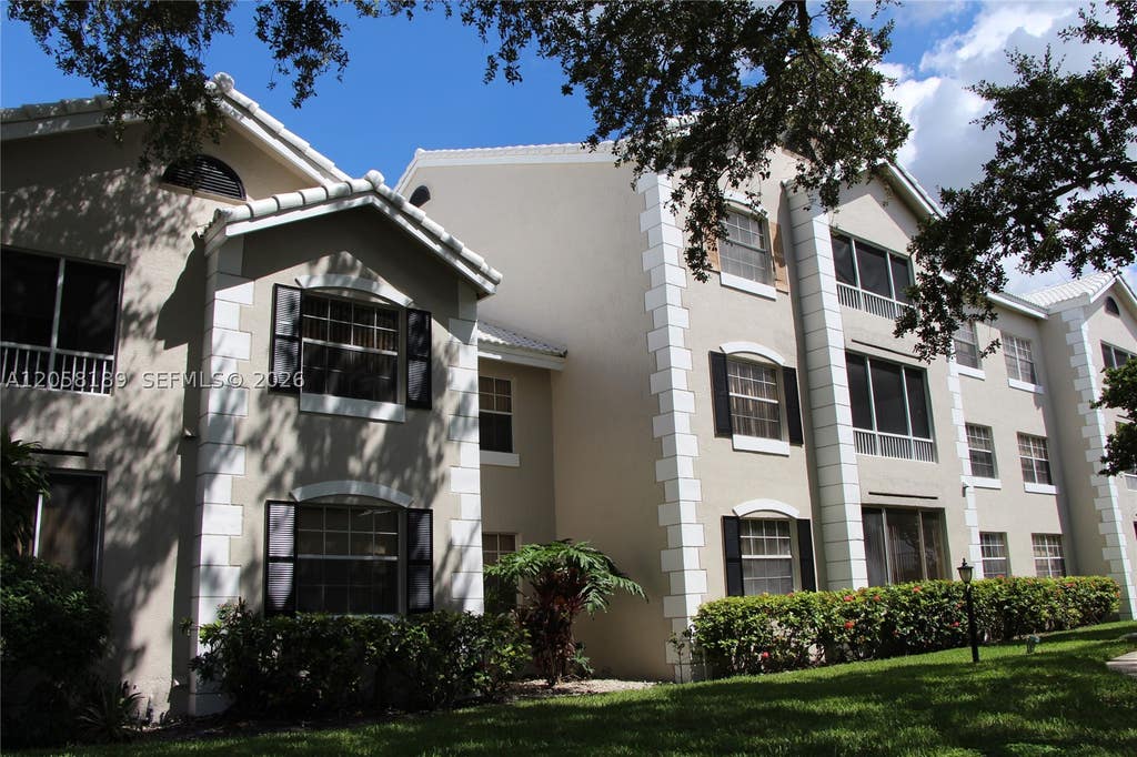 Photo of 2803 N Oakland Forest Dr #108, Oakland Park, FL 33309 (MLS # A12058189)