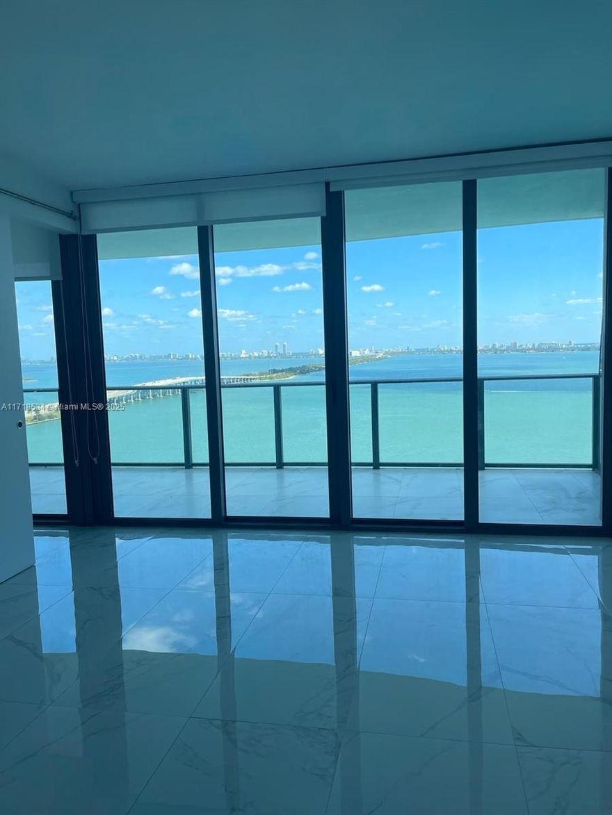Amazing unit with open direct water views of Biscayne bay and Miami Beach. One Paraiso is a luxuries building near the famous design district and midtown area. Full equipped with top amenities such as three pools, spa area, indoor jacuzzi, tennis courts, fitness center. The unit has a private elevator and foyer access. Gourmet kitchen and top appliances.