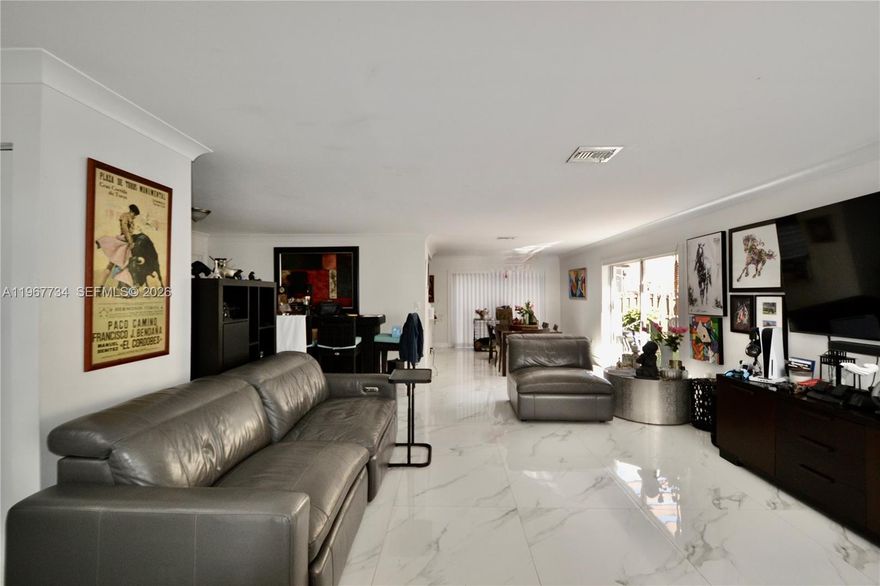 Remodeled modern comfort and style in this beautiful 3-bedroom, 2.5-bath, 1-car garage, two-story home located in the gated community of Vizcaya at The Hammocks. This home features a fantastic floor plan with open formal living and dining rooms, perfect for entertaining. The beautiful kitchen includes a gas range and updated finishes. All bathrooms have been remodeled with modern touches. Porcelain floors run throughout the first floor, while the second floor features laminated flooring. The welcoming primary suite offers a spacious walk-in closet and a comfortable retreat. Enjoy all the amenities the community has to offer in this desirable and well-maintained neighborhood.