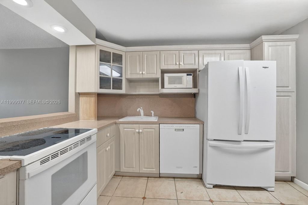 Photo of 823 Cypress Blvd #104, Pompano Beach, FL 33069 (MLS # A11999077)