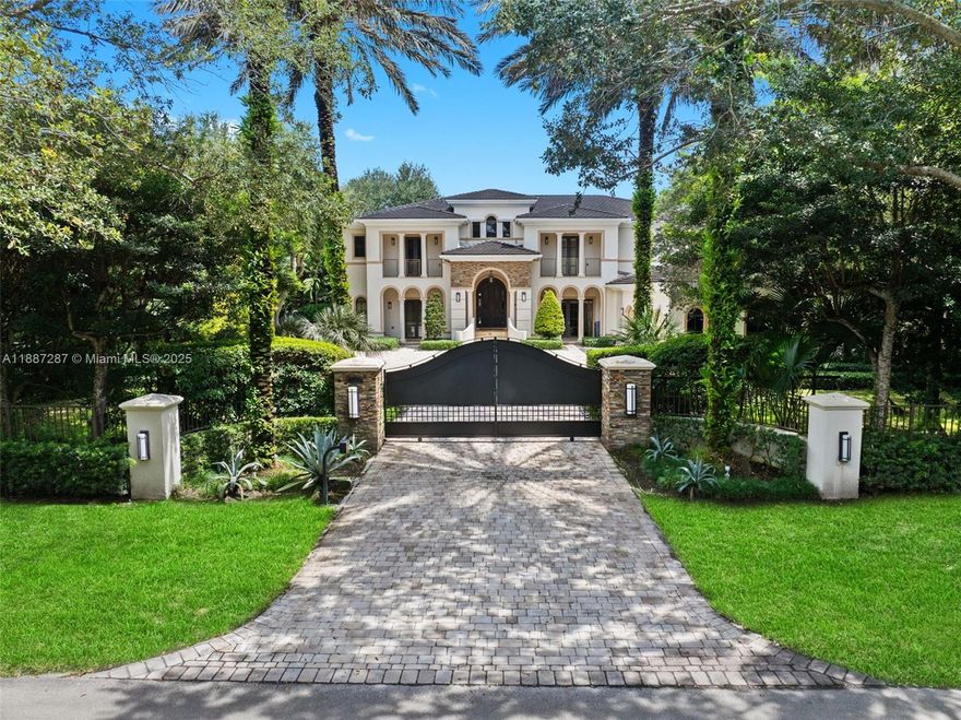 Gated & beautiful mediterranean estate in North Pinecrest sitting on a private 36,590 sq.ft corner lot. The 2-story main home features a double-door foyer entrance with 22' high ceilings & layout of 6 bedrooms, 5.5 bathrooms, a home office, theater/media room, two family rooms, formal and informal dining, laundry room, wine cellar, wet bar, a gourmet kitchen with Viking appliances and walk-in pantry. Separate 1/1 guest house with full kitchen & a gym. Exterior features include a complete summer kitchen, putting green, heated pool with jacuzzi & two outdoor living and dining areas. Additional fts. include elevator, fireplace, a full security system, surround sound throughout, extensive custom exterior and interior lighting, generator & a 3-car garage with a built-in storage system.