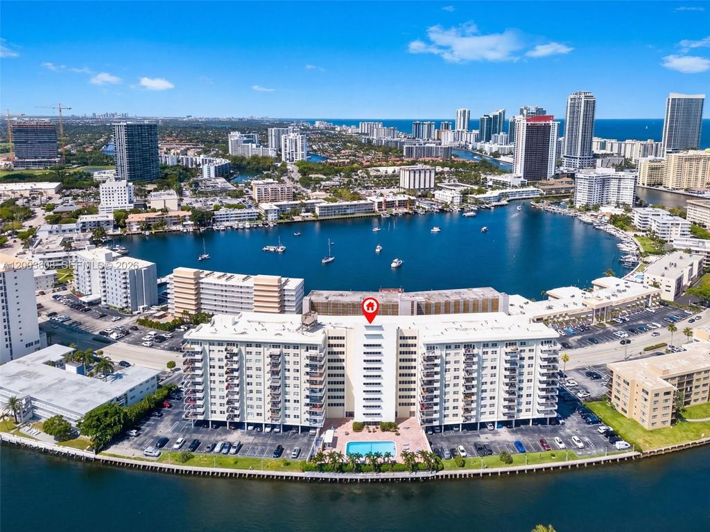 Photo of 401 Golden Isles Dr #303, Hallandale Beach, FL 33009 (MLS # A12003608)