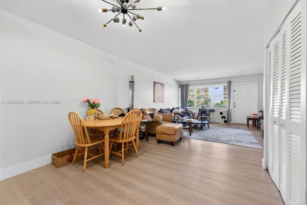 Photo of 401 Golden Isles Dr #303, Hallandale Beach, FL 33009 (MLS # A12003608)