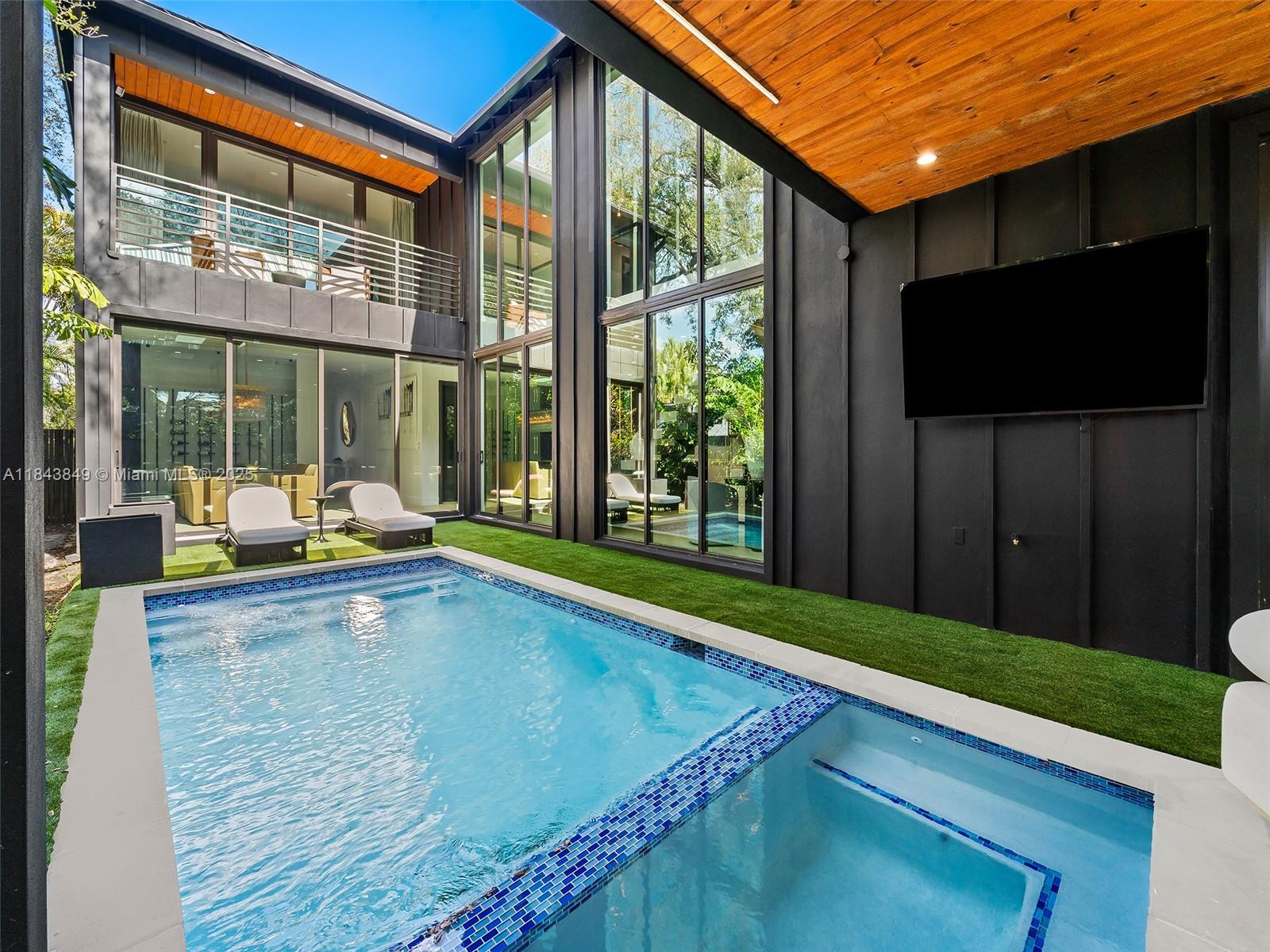 WELCOME HOME! A beautiful modern new construction home in the charming Victoria Park, offers 5 bedrooms, each with an en-suite bathroom, plus an office / game room. This luxury home comes fully furnished with high-end appliances and fixtures. A culinary gourmet kitchen with large center island overlooking the pool area, floor to ceiling windows & multiple doorways blending indoor & outdoor tropical living. A big formal dinning area with a glass wine room. 2 masters with covered balconies. Outdoor sitting area with a heated pool, and a waterfall cascade from the ceiling of the covered balcony into the pool. Full laundry room, 2 car garage. Located just minutes away from Las Olas Blvd, shopping centers, Ft Laud beach, and a short drive to the airport.