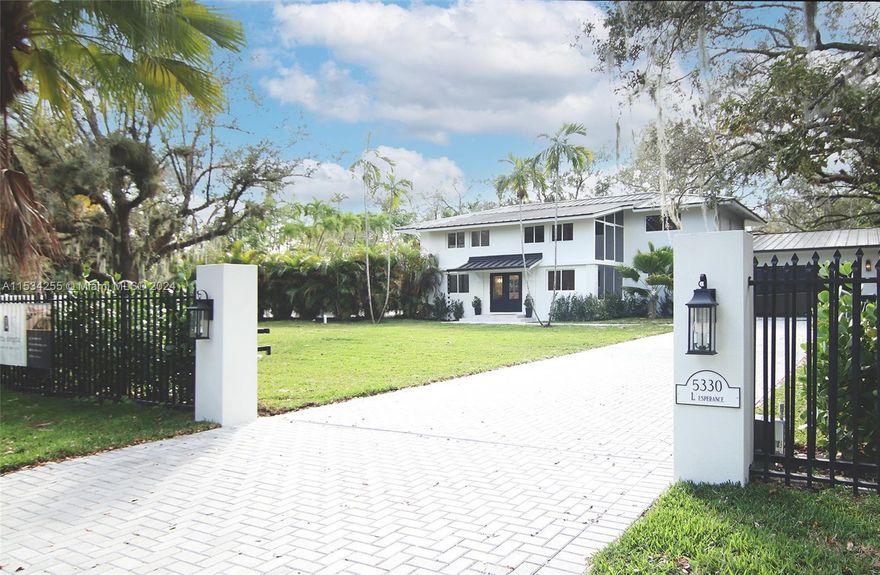 Welcome to your dream home! A fully gated 21,000sqft property offering beautiful landscaping. This newly remodeled 2-story home is now 4,112 sqft of living. It has 5 bedrooms and 5.5 bathrooms, plus office, playroom and upstairs & downstairs laundry rooms. Custom Café appliances with a 48” built-in fridge and walk-in pantry. This home has new engineered oak wood floors throughout, ample storage and is filled with natural light. Enjoy the ultimate backyard experience with a newly remodeled pool & spa and 2 separate pergolas with an outdoor kitchen perfect for entertaining. Newly added 2 car garage for convenience.
Also new: all electrical, all plumbing, ACs & ducts, septic system, metal roof, impact windows/doors, water heaters, pool equipment, driveway and more. Designed by Porta Negra.