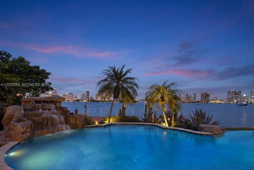 Set on one of Hibiscus Island’s most coveted parcels, this waterfront estate is more than a home—it’s a statement of lifestyle. Wake to sweeping skyline views and end each day with breathtaking sunsets over the bay. Designed for both grand entertaining and effortless living, the residence offers over 6,000 SF of refined interiors where timeless architecture meets modern luxury. Situated on an oversized 18,463 SF lot with 125 FT of prime waterfront, it features a private dock and boat lift with direct Biscayne Bay access. The 5BD/6.5BA home is within a gated, police-guarded community offering tennis, basketball, and a playground. A rare opportunity to own a slice of Hibiscus Island, where every day feels extraordinary. Some images virtually staged.