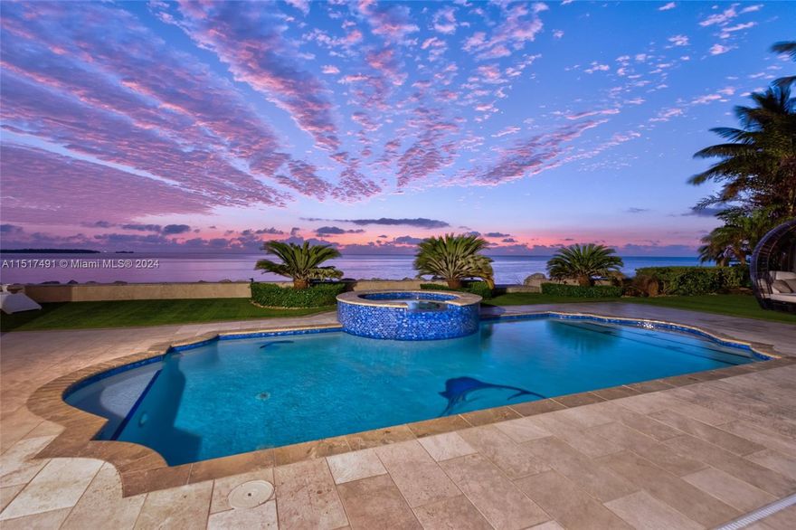 Indulge in luxury living with this exquisite residence in the exclusive gated community of Ocean Cay, situated along the pristine shores of Port Largo on the island of Key Largo. An impressive 100 feet of canal front and 85 feet of protected dockage featuring a 40,000-pound lift and davits, deep-water canal provides direct access to the Atlantic Ocean with unparalleled fishing and beautiful reefs. Third-floor total remodel with epic shower and tub area, coffee and wine bar, porch overlooking the ocean, spacious closet. Pool and jacuzzi with cabana and grill area. Sturdy concrete structure, concrete roof providing 360-degree views of the island, and impact windows.