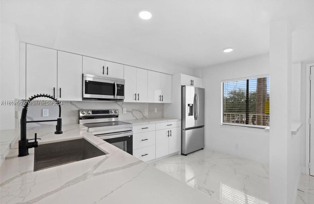 Photo of 7290 Kinghurst Dr #306, Delray Beach, FL 33446 (MLS # A11697575)