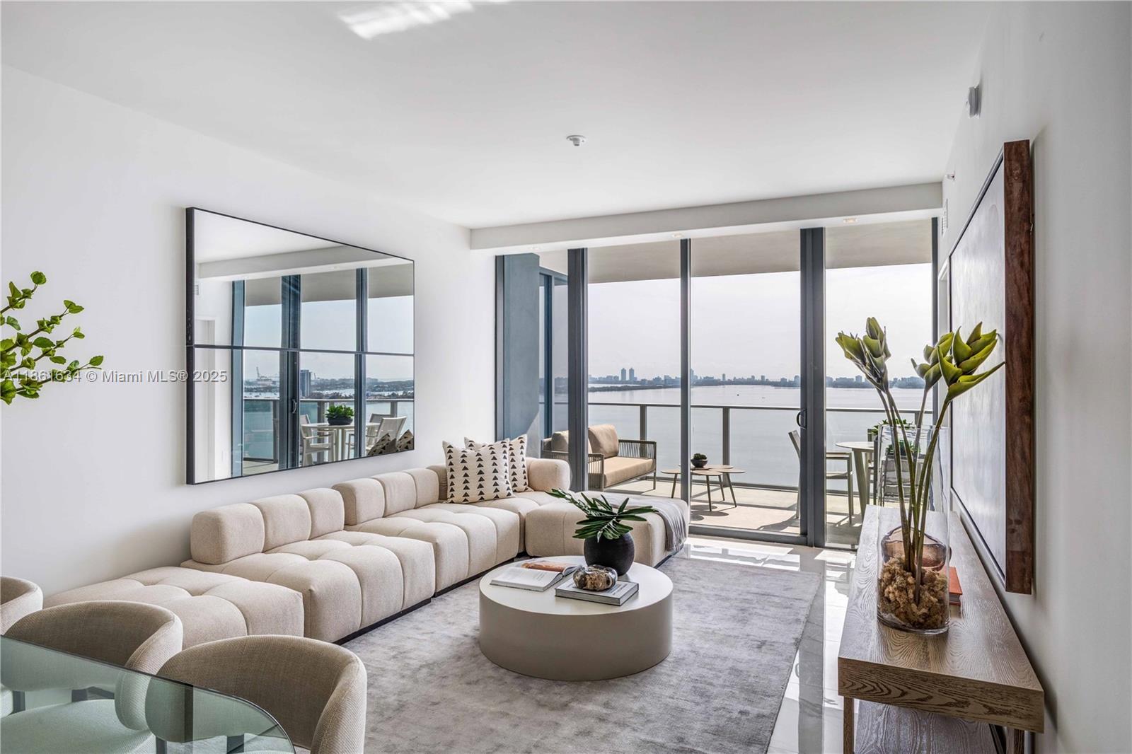 Experience the newest jewel of Edgewater Aria Reserve. This spacious 2-bedroom + den, 3-bath residence offers a flow-through layout with floor-to-ceiling glass framing panoramic views of Biscayne Bay. Thoughtfully customized with glass-enclosed showers, motorized shades, and bespoke closets, every detail has been curated for modern elegance. The expansive private terrace creates a seamless indoor-outdoor lifestyle, perfect for entertaining or unwinding over the water. Ideally located at the nexus of art, culture, and fine dining, Aria Reserve delivers resort-style amenities and Miami’s most desirable waterfront living. Seller is open to cryptocurrency offers, with preference for Ethereum, offering buyers unique flexibility in this highly sought after neighborhood.