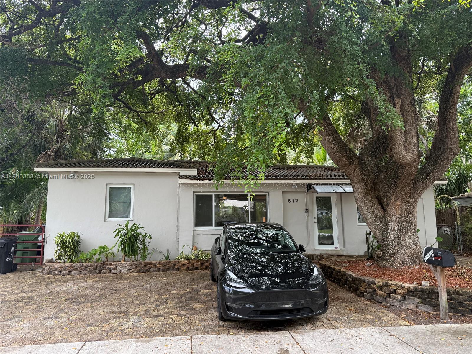 Discover coastal charm in this 2 bed/2 bath single-family home in Fort Lauderdale, steps from downtown, Las Olas, and the beach. Cedar finishes accentuate the kitchen and both bathrooms, creating a warm, inviting ambiance. The open floor plan is filled with natural light, highlighting the cozy layout perfect for small families or entertaining. Enjoy limited ocean access. Install a floating dock for boating adventures. Located east of I-95, this home offers easy access to major roads for seamless commuting. The home also features plenty of parking with 4 spots located in the front. Embrace the waterfront lifestyle in this tropical retreat!