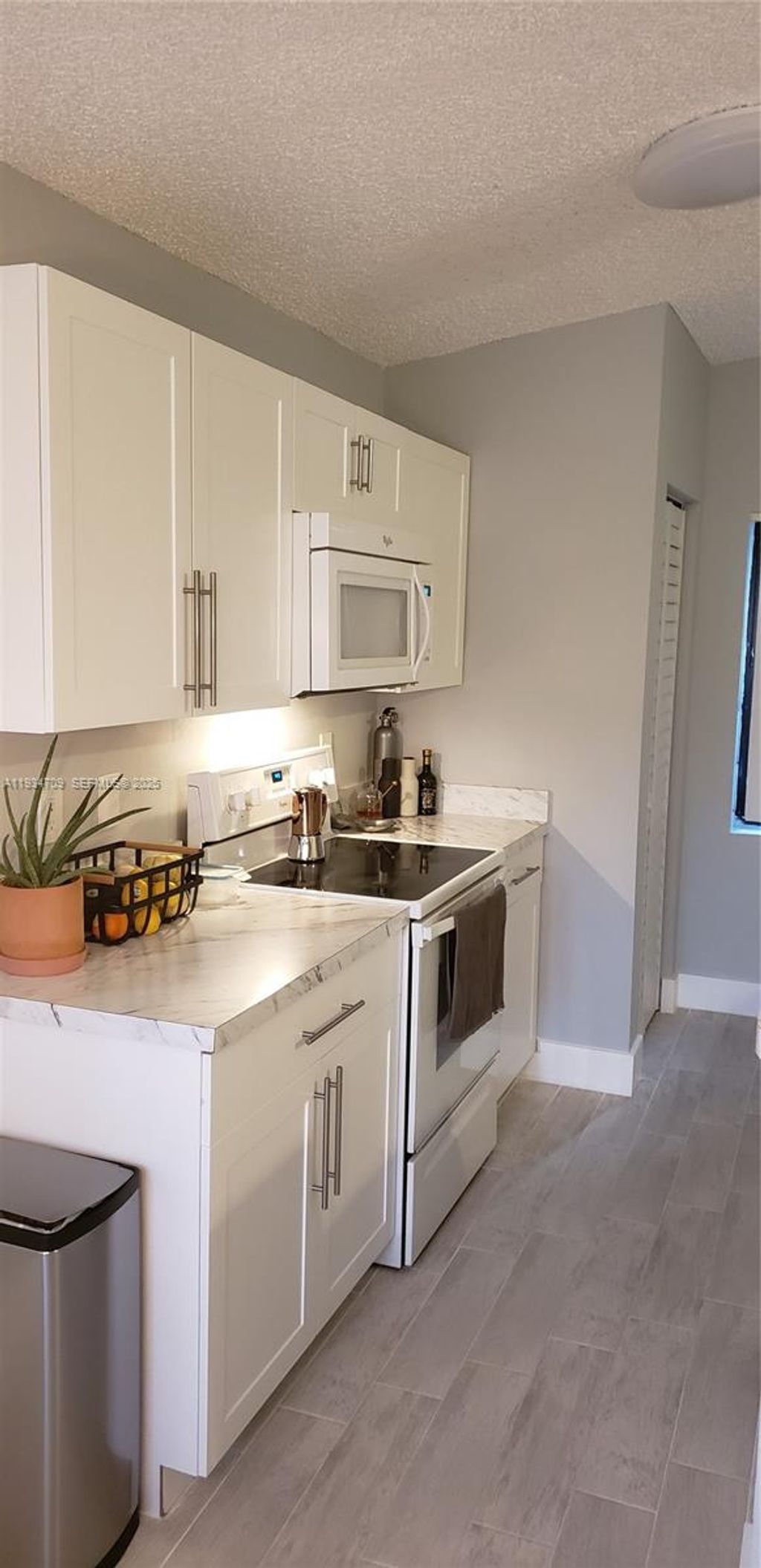 Photo of 9999 Summerbreeze Dr #720, Sunrise, FL 33322 (MLS # A11934709)