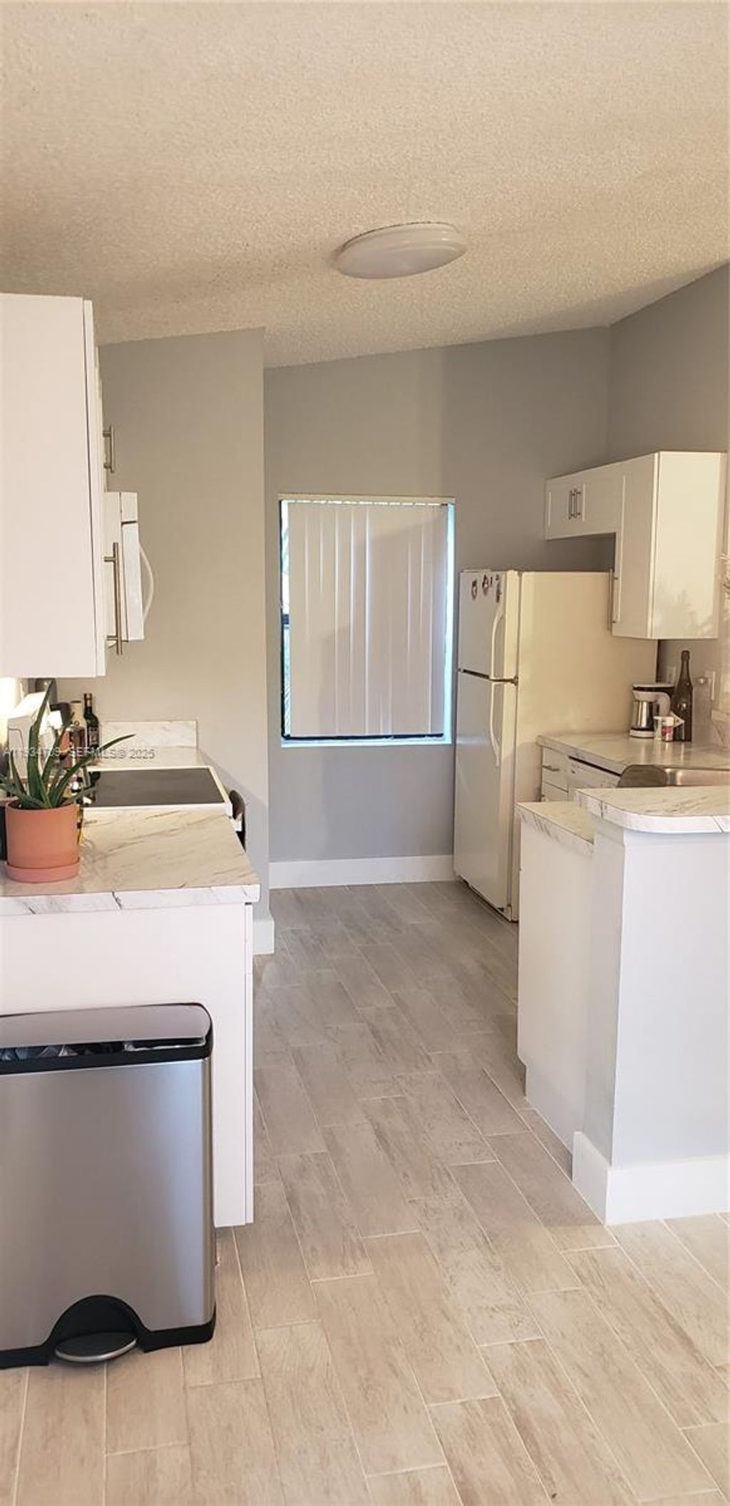 Photo of 9999 Summerbreeze Dr #720, Sunrise, FL 33322 (MLS # A11934709)