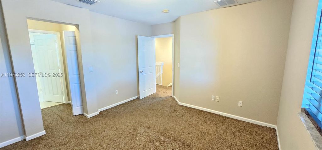 Photo of 2014 Marsh Harbor Dr, Riviera Beach, FL 33404 (MLS # A11979853)