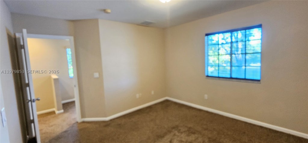 Photo of 2014 Marsh Harbor Dr, Riviera Beach, FL 33404 (MLS # A11979853)