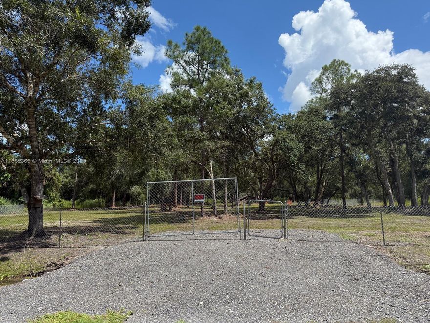 Spacious 1.25-acre lot located at 465 S Estribo St, Clewiston, FL 33440 in Montura Ranches. This beautiful property is fully fenced, cleared with selected trees, and ready for your dream home or ranch. No HOA, no wetlands, and not in a flood zone, offering peace of mind and flexibility. Perfect for country living with plenty of space for animals, gardening, or recreational use. Enjoy privacy, freedom, and the tranquility of rural Florida living while still being close to town amenities.